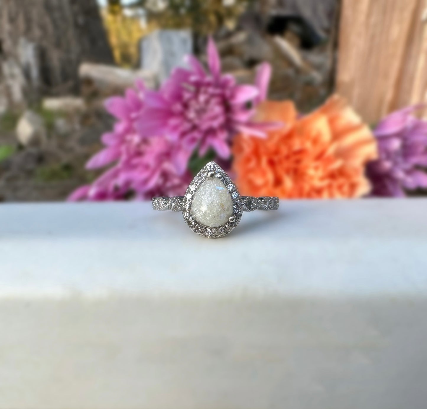 Vintage style pear ring with diamond dust and opal flakes.
